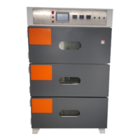 Three-door vacuum oven